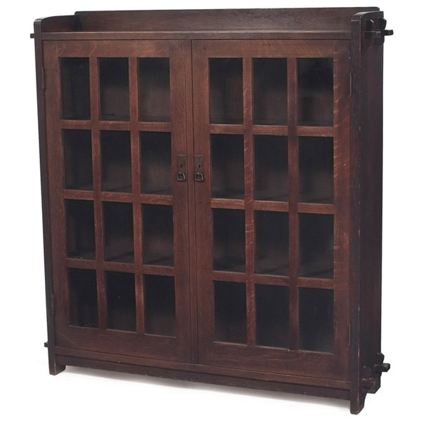 L & JG Stickley bookcase #645: L & JG Stickley bookcase, #645, two-door form with twelve panes of glass per door and original hardware, slab sides supported by double key and tenon construction, original finish, signed "The Work of