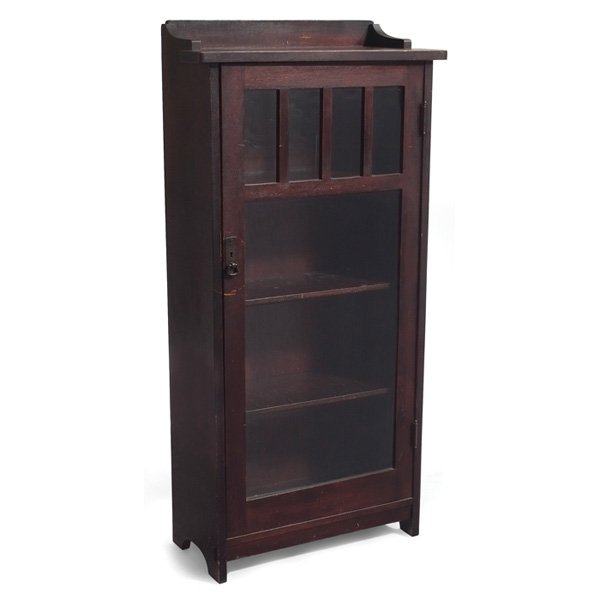 L & JG Stickley bookcase #653: L & JG Stickley bookcase, #653, single-door form with divided panes at top and original hardware, over-coated finish, some roughness, unsigned, one cracked pane of glass, 27"w x 12.5"d x 55"h, good co