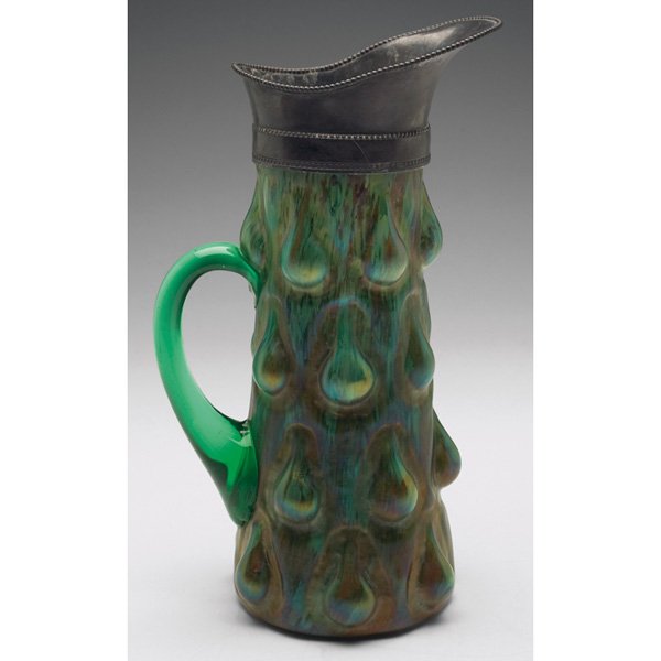Kralik handled vessel: Kralik handled vessel, Humpen pattern in lime green glass with mottled brown accents, overall iridescence, applied pewter spout, 7"w x 11"h