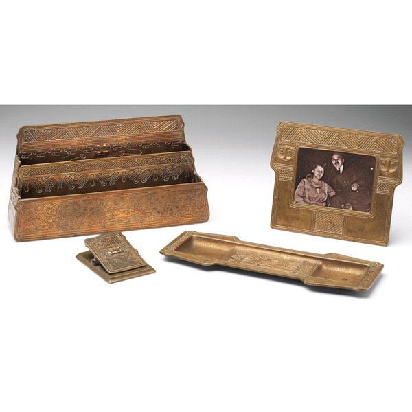 Tiffany Studios desk set: Tiffany Studios desk set, letter rack: #1186, 11"w x 6"h; pen tray: #1185, 4"w x 11"l; frame: #1187, 7"w x 6"h; clip: #1190, 3"w x 4"l; all bronze in the American Indian pattern, all in an original go