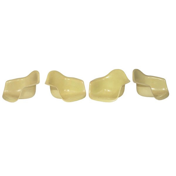 Charles & Ray Eames shells: Charles & Ray Eames shells, four, by Herman Miller, no bases, molded light yellow fiberglass, original finish, signed with Herman Miller stamped marks, 25"w x 23"d x 16"h, good original condition