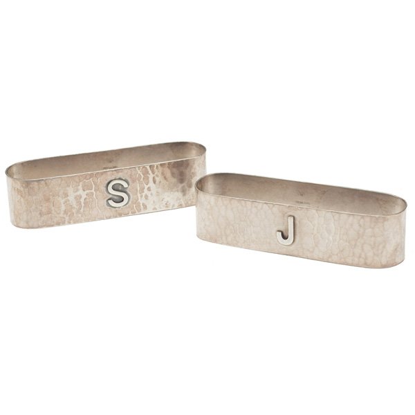 Kalo napkin rings sterling silver: Kalo napkin rings, two, hand wrought sterling silver, applied monograms, marked, each is: 3.5"l