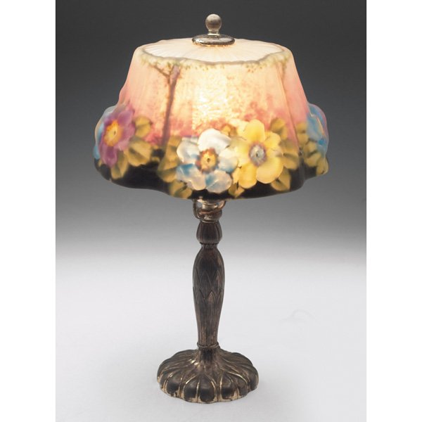 Pairpoint Puffy boudoir lamp: Pairpoint Puffy boudoir lamp, metal base with a silver lacquer finish, holding a frosted and pink glass shade with colorful flowers against a stylized landscape, base and shade signed, overall: 9"w x 