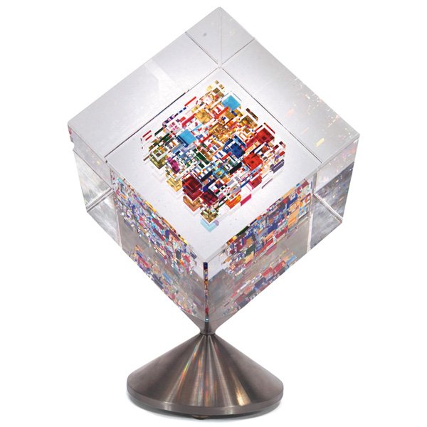 Jon Kuhn Optical glass cube: Jon Kuhn Optical glass cube, 2003, clear glass cube with brilliantly colored inclusions rotates over a steel base, signed "Jon Kuhn 2003 December", glass is 4.25" square, total height: 8.5"h, mint con