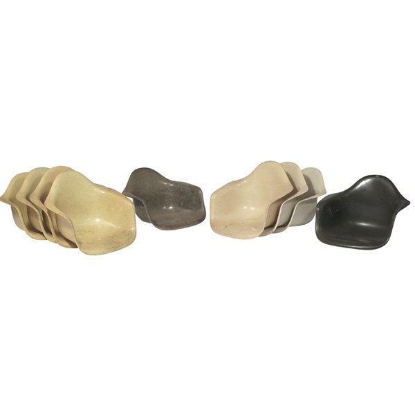 Charles and Ray Eames shells Herman Miller, set of 9: Charles and Ray Eames shells, group of nine, by Herman Miller, fiberglass, 4 yellow, 3 parchment, 1 brown and 1 gray-green, no bases, good original condition