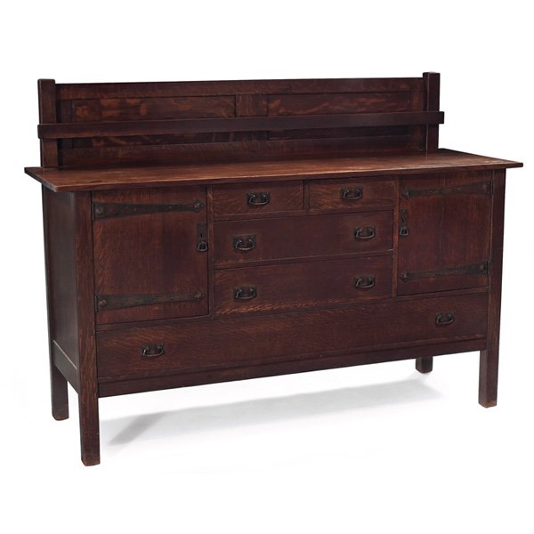 L & JG Stickley sideboard: L & JG Stickley sideboard, #736, large form with plate rail at back above a series of doors and drawers with original hammered copper pulls and strap hardware, original finish, unsigned, 66"w x 22"d x