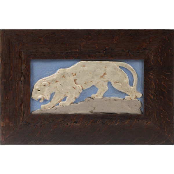 Teco tile: Rare Teco tile, decorated with a white strident lion on a gray naturalistic rocky ground and blue sky, period frame, unsigned but glaze numbers written on back, 11.5"w x 6"h, 17.25"w x 11.5"h overall