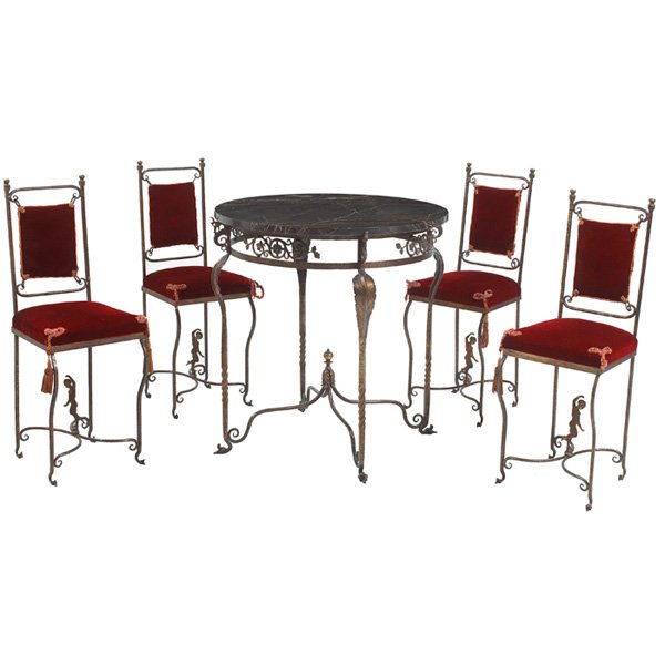 Oscar Bach style cafe set iron: Oscar Bach style cafe set, in wrought iron, table with round marble top, pierced foliate and seahorse decorated frieze, leaf form legs joined by X-form stretcher, 21"dia x 30.5"h; four side chairs wit