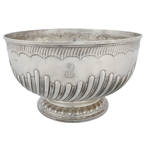 George III silver punch bowl: George III Silver Punch Bowl, maker's mark WS (for William Stroud, Sharp or Schofield), London, 1805, of circular form with reeded decoration, raised on a conforming foot, bearing a crest of a lion's 