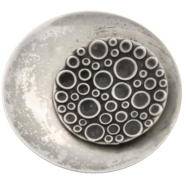 Finnish Modernist brooch Turku silver: Finnish Modernist brooch, Turku, 1964, in silver, circular form with applied conforming disc decorated with oxidized circles, maker's mark of a strident bear/karhu, 813 silver standard, 1.5"dia