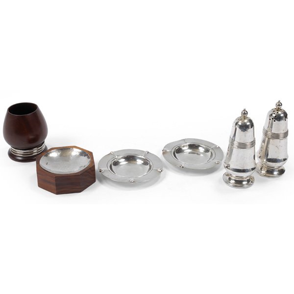 William Spratling sterling casters coasters ash receive: William Spratling group of six items: pair of sterling casters, 4.75"h; pair of sterling coasters/ash receivers, 3.75"dia; sterling and rosewood ash receiver, 3.5"w x 1.25"h; rosewood cup with sterlin