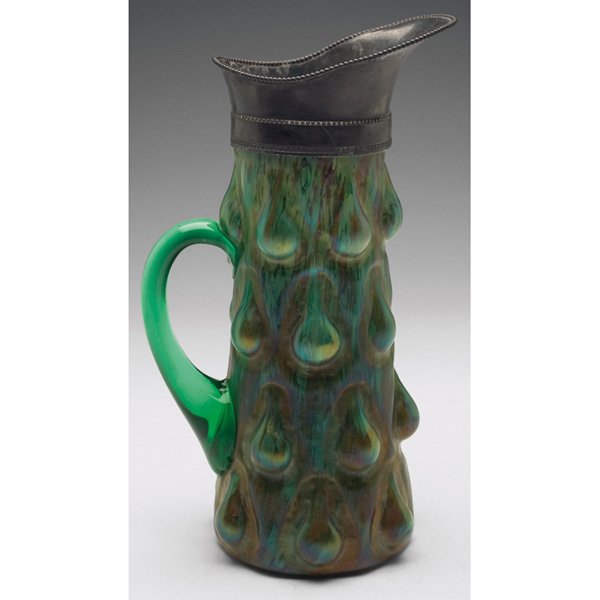 Kralik handled vessel Humpen pattern: Kralik handled vessel, Humpen pattern in lime green glass with mottled brown accents, overall iridescence, applied pewter spout, 7"w x 11"h
