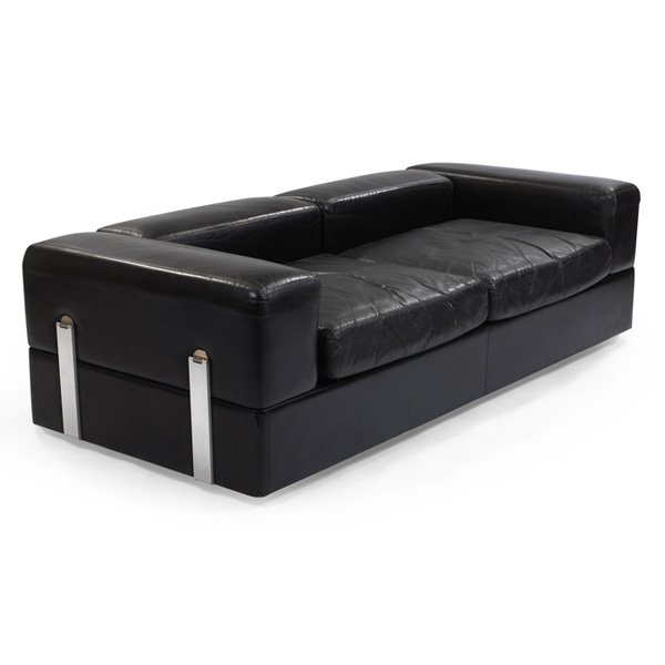 Stendig sleeper sofa 1960s 1970s: Stendig sleeper sofa, designer unknown, 1960s-70s, backrest and armrests fold to reveal white laminate tops and a sleeping surface, original black leather, stainless steel hardware, on castors, signed