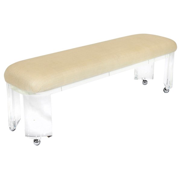 Karl Springer Prisma bench Lucite: Karl Springer "Prisma" bench, heavy solid Lucite frame with rounded legs and a padded seat upholstered in off-white silk, on castors, 61"w x 17"d x 20"h, very good original condition