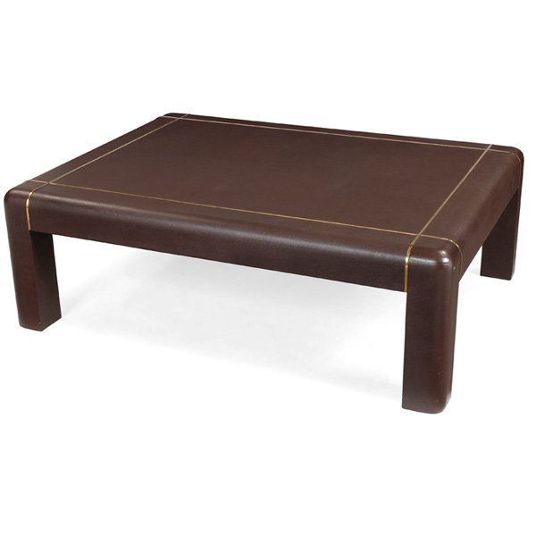 Karl Springer coffee table: Karl Springer coffee table, iconic rectangular form covered in dark brown lizard, inset brass trim, signed with leather tag "Karl Springer 1985", 48"w x 36"d x 16"h, a few minor scuffs, excellent cond