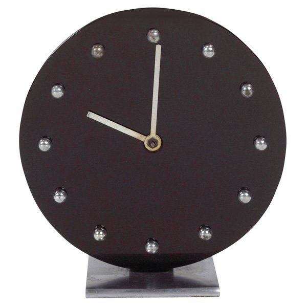 Gilbert Rohde Art Deco table clock Herman Miller: Gilbert Rohde Art Deco table clock, by Howard Miller, 1930s, round black glass face with chrome ball hour markers, steel base, original hands, 6"w x 3"d x 6.5"h, second hand missing, dents to back cas