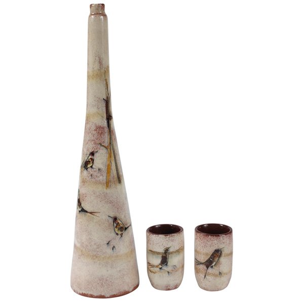Polia Pillin cordial set: Unusual Polia Pillin cordial set, three pieces, tall pitcher and two cups, glazed ceramic, hand-painted birds, signed, cups: 3.25"h, pitcher: 13.25"h, very good original condition