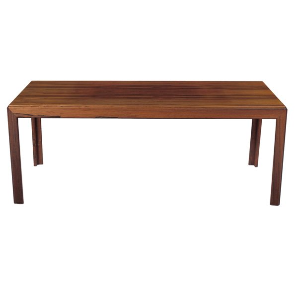 Danish rosewood coffee table: Danish rosewood coffee table, maker unknown, rectangular top with slightly rounded corners over four straight legs, subtle groove to outer edge of legs and edge of top, 55"w x 25"d x 21", original fin