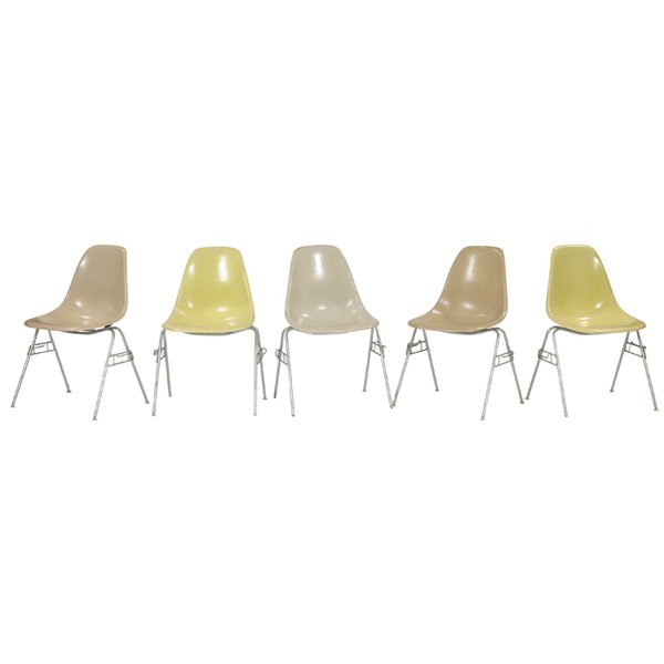 Charles & Ray Eames shell chairs Herman Miller, 5: Charles and Ray Eames shell chairs, 5, by Herman Miller, two ochre, two yellow and one white, zinc stacking bases, original finish, signed, some feet missing, very good original condition