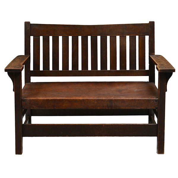 Gustav Stickley V-back settee, 212: Good Gustav Stickley V-back settee, #212, vertical slats at back over a fine original hard leather seat and tacks, fine original finish, signed with red decal, 47.5"w x 25"d x 36"h, excellent conditio