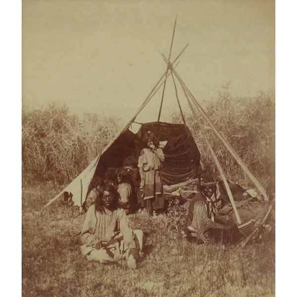 John K. Hillers (American, 1843-1925) Indians Sitting: John K. Hillers (American, 1843-1925) "Indians Sitting Around a Half-covered Tipi," albumen print, 4" x 3.5", framed. Property from the Estate of Robert E. Beck, Murphysboro, Illinois