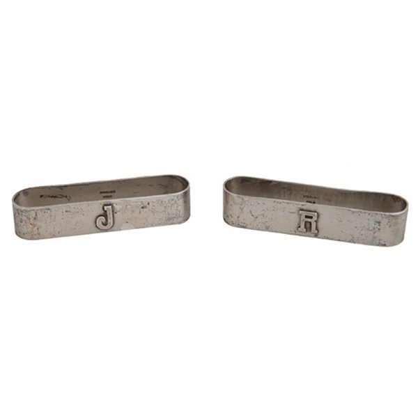 The Kalo Shop sterling silver napkin ring: A Lot - The Kalo Shop sterling silver napkin rings, two, each of elongated rectangular form with rounded sides, one with applied J monogram and the other with an applied R, marked Sterling/Kalo, 1.97 