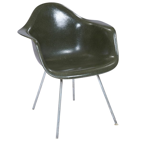 Charles & Ray Eames shell chair, by Herman Miller: Charles & Ray Eames shell chair, by Herman Miller, molded dark green fiberglass shell with zinc rod legs, signed with paper label, 25"w x 24"d x 31"h