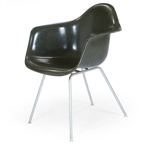 Charles & Ray Eames shell chair, by Herman Miller: Charles & Ray Eames shell chair, by Herman Miller, molded dark green fiberglass shell with zinc rod legs, signed with impressed Herman Miller mark, 25"w x 24"d x 31"h
