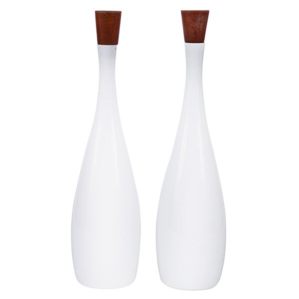 Holmegaard glass bottles, two, by Kastrup, Denmark,: Holmegaard glass bottles, two, by Kastrup, Denmark, blown white glass with the original teak stoppers, one signed with partial Kastrup foil label, 5"dia x 19"h, with a Mid-century jewelry or flatware