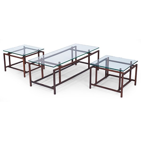 Komfort tables, three, Denmark: Komfort tables, three, Denmark, rosewood, coffee table and pair of end tables, notched glass tops fit on four posts with small pegs, original finish, one signed with "Komfort Made in Denmark" label, c