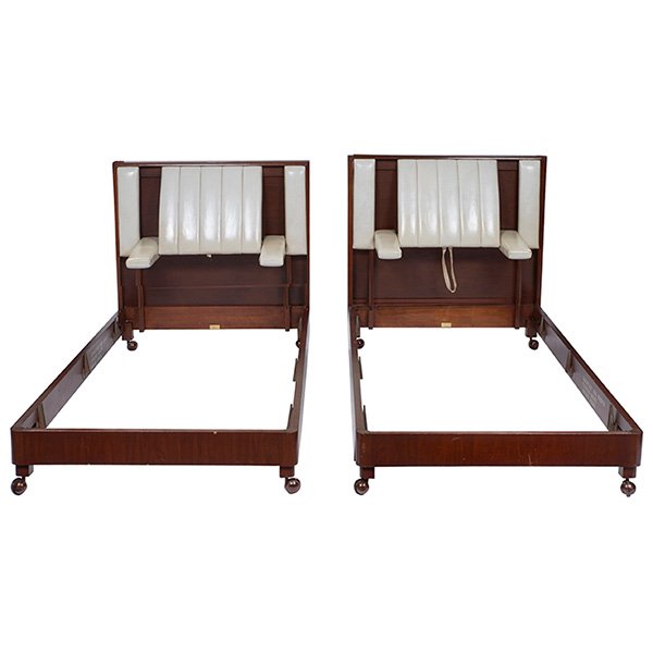 Edward Wormley beds, by Dunbar: Edward Wormley beds, pair, by Dunbar, twin size, each with a padded headboard with folding armrests, mahogany frames, original off-white leather, each with rectangular brass Dunbar tag, 41.5"w x 81.5"