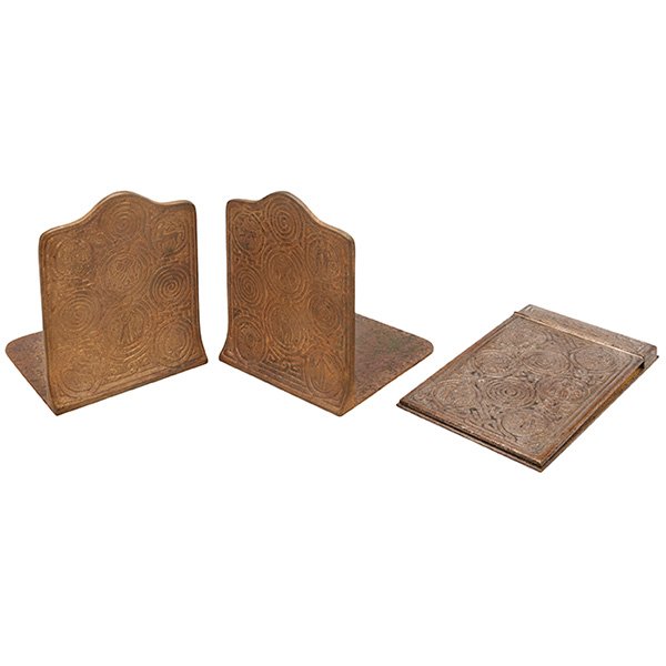 Tiffany Studios, Zodiac desk set: Tiffany Studios, Zodiac desk set: memo pad holder, #1090, bookends, pair, #1091, New York, NY, bronze, signed and numbered, largest: 4.5"w x 7.5"l