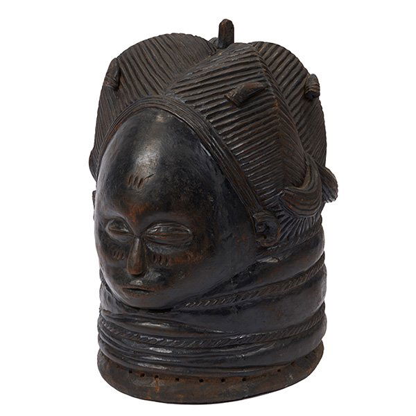 African mask: African, mask, carved wood, with stand, 10"w x 70"h overall on stand; 12"h of mask. Provenance: Property from the Collection of Governor Jim Thompson, Chicago, Illinois