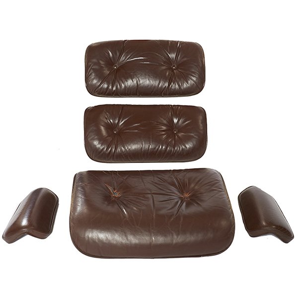 Charles & Ray Eames for Herman Miller 670 cushions: Charles & Ray Eames for Herman Miller, 670 chair cushions, brown leather, Herman Miller label, hardware not included; tears to seat cushion around tufted buttons, seat cushion: 25" x 21"