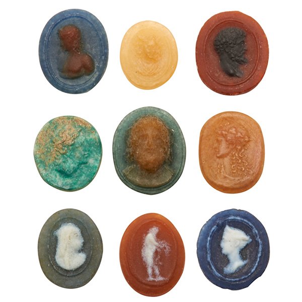 Henri Cros (1840-1907), attribution, medallions, group: Henri Cros (1840-1907), attribution, medallions, group of nine, France, pate-de-verre glass, all unsigned, Greek and Roman influences, largest: 1"l Literature: Victor Arwas, Glass, Art Nouveau to Art