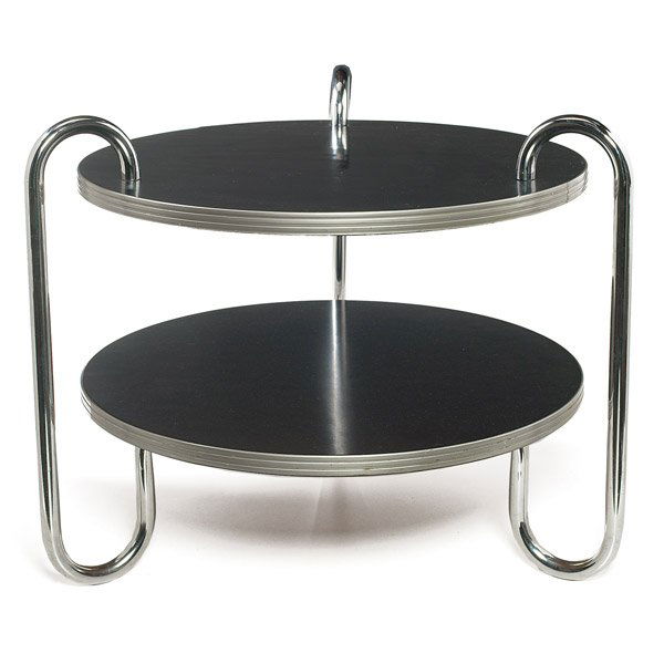 Gilbert Rohde coffee table: Gilbert Rohde coffee table, attribution, by Troy Sunshade, round top and lower shelf with original black surface and aluminum banding to edge, tubular chromed steel frame, marked with Troy Sunshade la