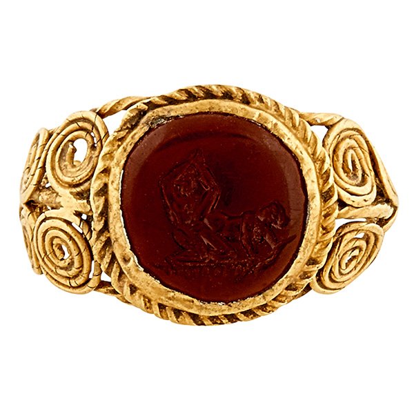 Roman, Circa 1st-2nd Century A.D. erotic intaglio ring: Roman, Circa 1st-2nd Century A.D., erotic intaglio ring, yellow gold twisted wire, carnelian, size: 7 1/2, Provenance: with Derek J. Content. Inc., London, England, 1994, Christie's, New York, NY, 09 
