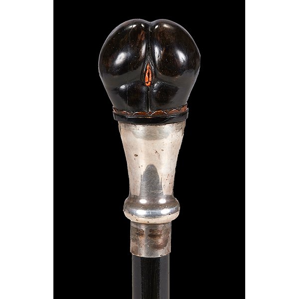 Erotic cane (woman bending over): Erotic, cane (woman bending over), ebonized wood and natural coral handle, silvered metal collar, ebonized wood shaft, brass ferrule, steel tip, handle/collar: 2 1/4"w x 1 3/4"d x 5 1/8"h; overall: 35