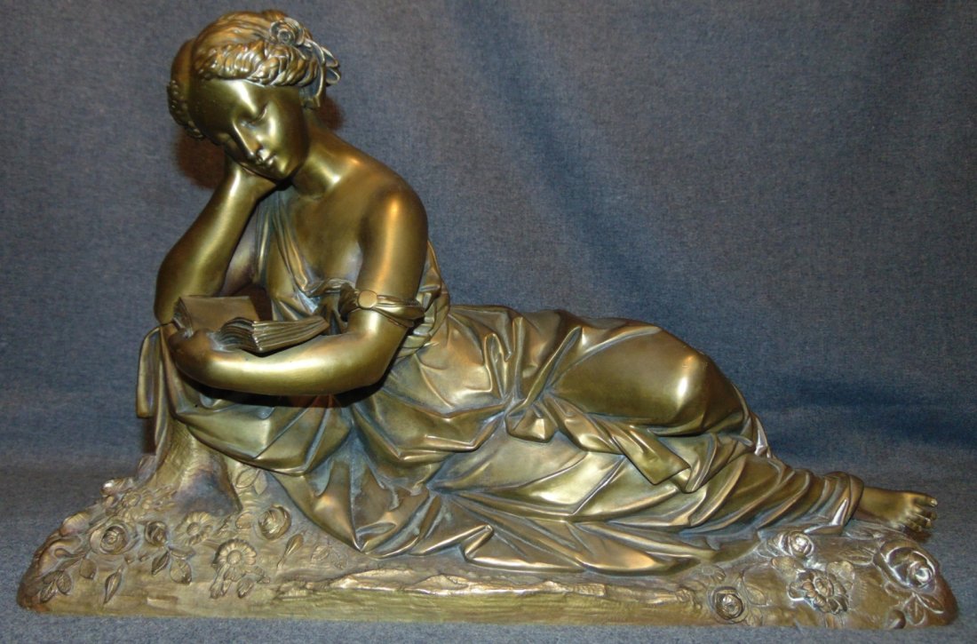 Antique Bronze Sculpture of a Reclining Woman: Antique Bronze Sculpture of a Reclining Woman Reading a Book. Artist Signed. Excellent detail and High Quality. Measures 11-3/4" tall x 18-1/2" wide. Condition is very good with minimal wear and minor