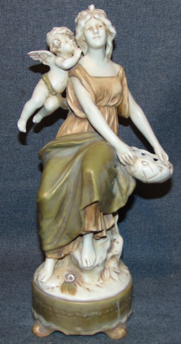Antique Royal Dux Art Nouveau Figure Woman & Cherub: Beautiful Antique Royal Dux Art Nouveau Porcelain Figure of a Woman and Cherub. She stands 14-1/4" tall. Condition is very good with minimal wear. No damage. Bottom is marked. Starting Bid $50.