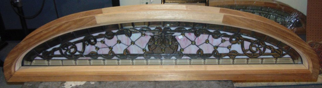 Mahogany and Stained Glass Window Transom: Mahogany and Stained Glass Transom for a Door or Window. Raw, Solid Core Mahogany Frame with Stained glass panel sandwiched between "Tempered Glass" panels. For indoor or outdoor. Measures 16-1/2" tal