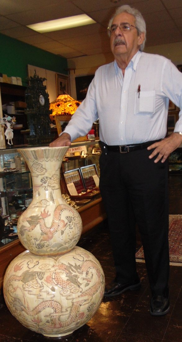 Oriental Carved & Etched Bone Floor Vase: Oriental Carved & Etched Bone Tiles Floor Vase. Measures 41" tall x 22" wide. Condition is very good. No Damage. Starting Bid $50. Auction Estimate $300 - $400.