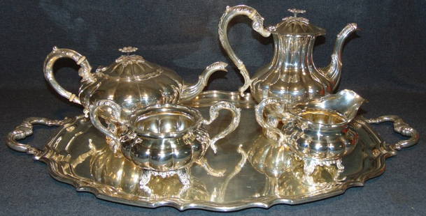 Sterling Silver Birks Canada "Mellon" Tea & Coffee Set: Magnificent 5 piece Sterling Silver Tea & Coffee Set by Henry Birks & Sons, Montreal 1943. The Melon pattern. Set includes Sterling Silver teapot, coffee pot, creamer, sugar bowl and Silver Plated Tra