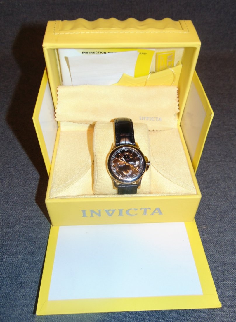 Mens Invicta LE 18-carat Gold and Platinum Wrist Watch: NEW Mens Invicta Limited Edition 18-carat Gold and Platinum Wrist Watch. LE #43 of only 100. Alligator Band. Powered by the 20-jewel automatic Valjoux movement with 40-hour power reserve, this Limited