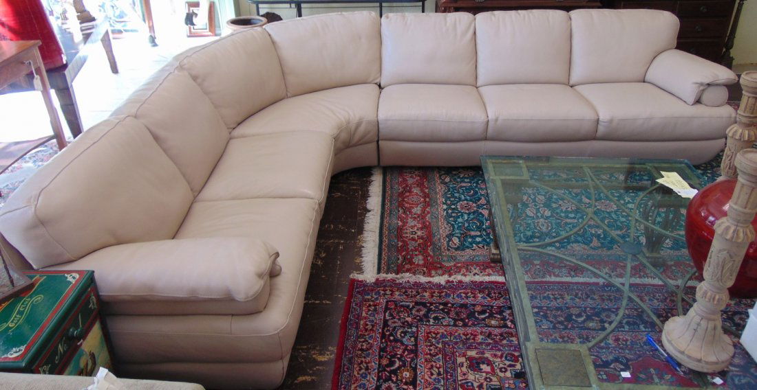 Natuzzi Leather Sectional with Corner Wedge: Natuzzi Beige Leather Sectional with Corner Wedge. Measures 8' x 11'. Overall condition is good to excellent. One small scuff on side (see close-ups). Not a recliner. Several Shipping Options Availabl