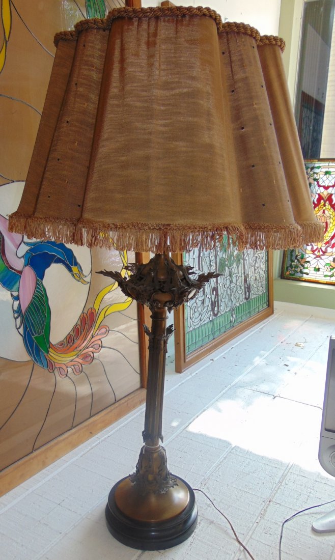 Antique Bronze Table Lamp: Large Antique Bronze Table Lamp. Measures 46" tall x 27" wide. Overall condition is good with minor wear. Starting Bid $50.