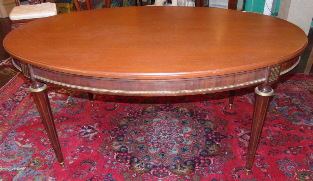 Antique Mahogany Oval Dining Table: Antique Mahogany Oval Dining Table, Circa 1940's. Measures 29" tall x 62" wide 43" deep. Condition is good. 2 small marks on surface (see close-ups). Several Shipping Options Available. Starting Bid $