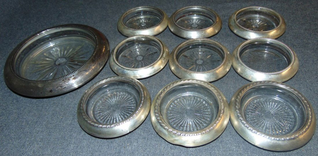 Misc Set of Sterling Wine Coasters: Misc Set of Sterling Wine Coasters. 9 Wine Glass and one Wine Bottle Holder. Overall condition is good. Starting Bid $30.