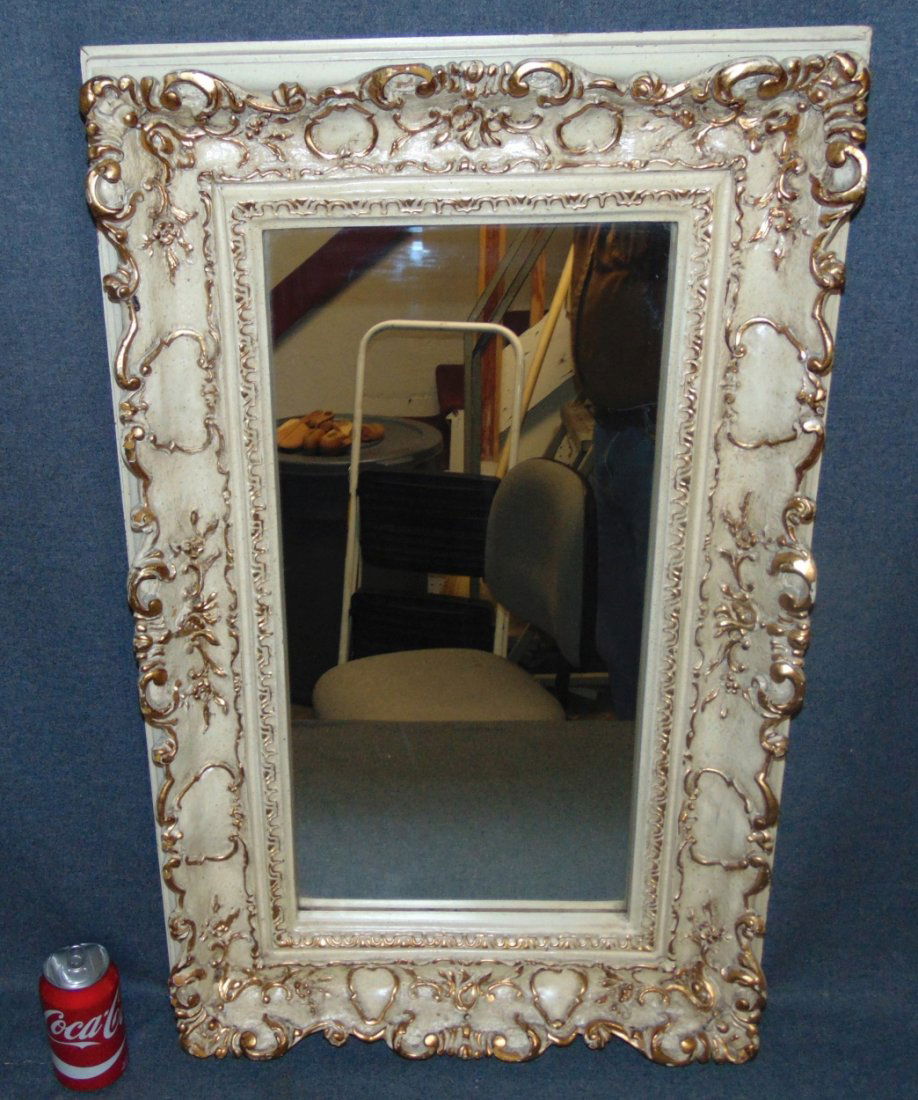 Vintage Wall Mirror: Vintage Wall Mirror. Measures 33" tall x 21" wide. Overall condition is good with minor wear. Some paint losses. Starting Bid $30.
