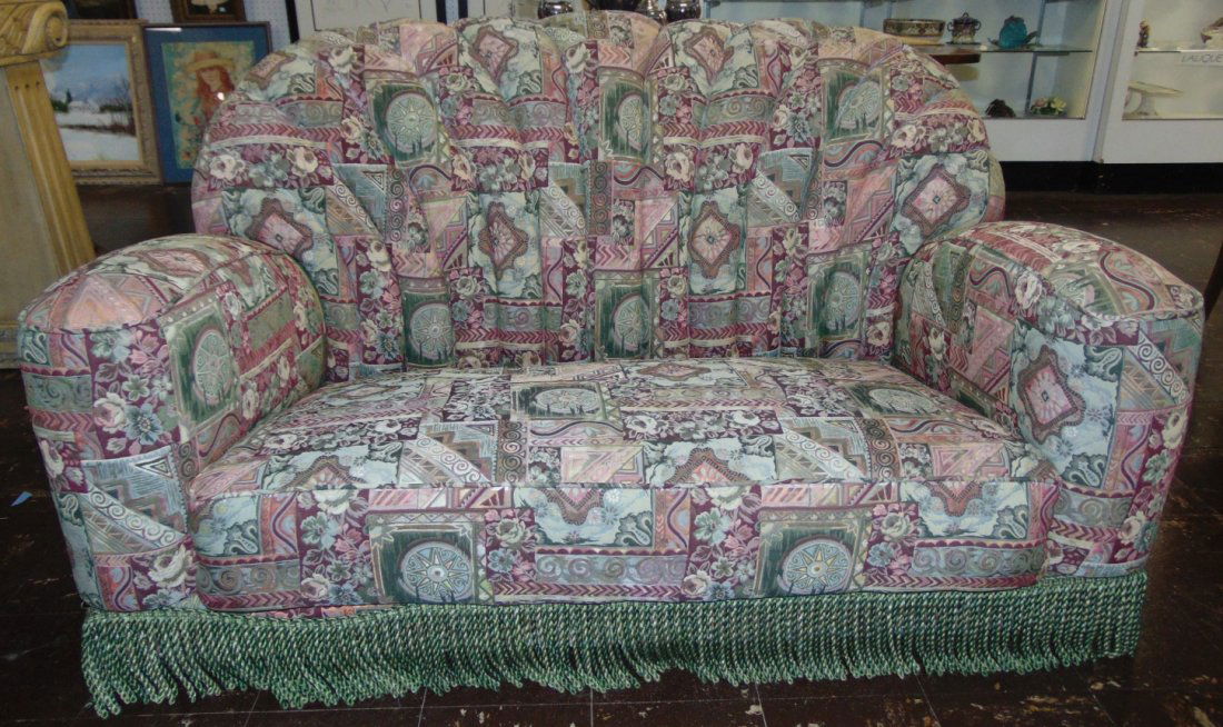 Vintage Art Deco Upholstered Sofa: Vintage Art Deco Upholstered Sofa with Fringe on base. Measures 33" tall x 60" wide x 38" deep. Condition is very good with some minor wear. No damage. Several Shipping Options Available. Starting Bid